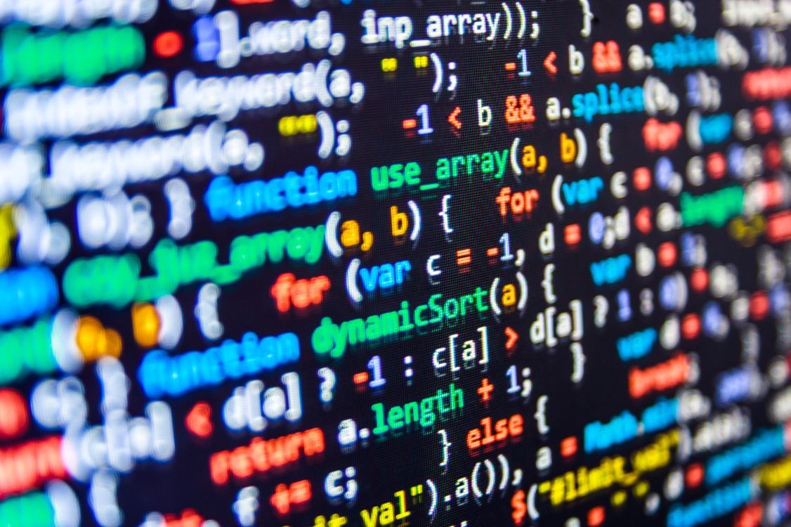 Source code open in an editor on a screen, representing applied data preparation in Python and R